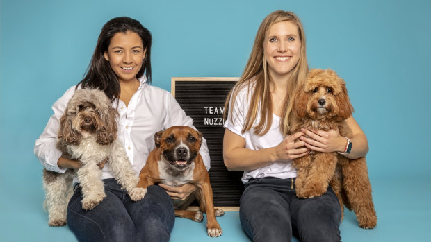 Nuzzl founder Erin Corcoran, left, and Erin Soll with Cali, Zara and Millie. 