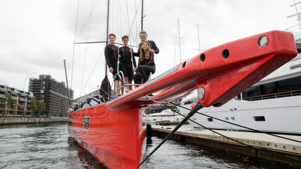All aboard: Owner Jim Cooney with his children James, Douglas and Julia on  Comanche ahead of the Sydney to Hobart.