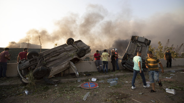 The force of the explosion flipped cars on the roofs. 