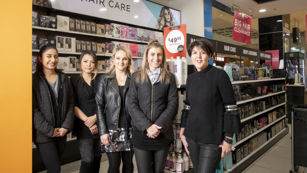 Hairhouse Warehouse Canberra Centre staff Ishita Singh, Saki Hong, Magdalena Hatusiewicz, manager Nicole Crisp and owner Cathy Coppen at the salon and retail store, which will close on July 22.