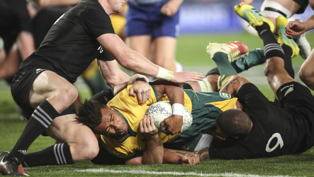Rare sight: Will Genia scored Australia's first try. Only one more was to come for the visitors in a 40-12 loss. 