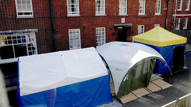 Tents set up by search teams are seen outside the John Baker House for homeless people in Salisbury as police continue their investigations.
