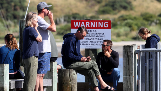 People comforting each other at Whakatane following the White Island volcano eruption.