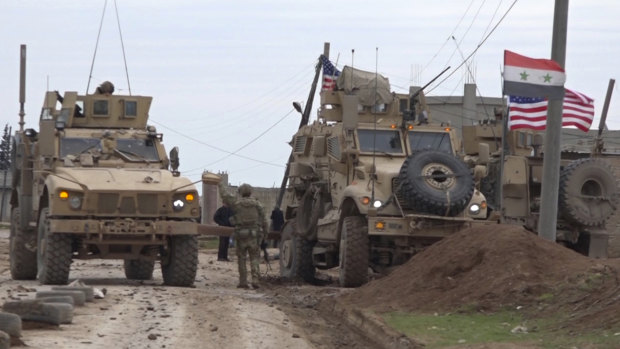 American military convoy is seen in the village of Khirbet Ammu, east of Qamishli city, Syria.