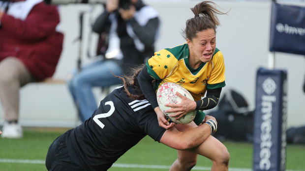 Not enough: Cobie-Jane Morgan is hauled down by the Black Ferns defence.