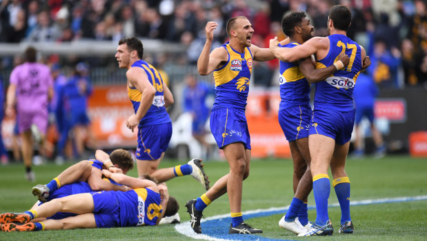 Dom Sheed (centre) celebrates with teammates on the siren.