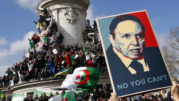 Demonstrators stage a protest to denounce President Abdelaziz Bouteflika's bid for a fifth term on Place de la Republique in Paris on March 10.