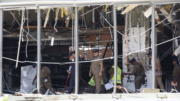Police investigate the damage at the Shangri-La Hotel in Colombo.