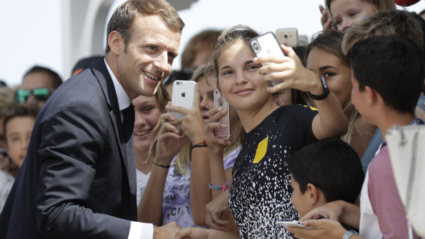 French President Emmanuel Macron shakes hands with wellwishers during a visit to the French Caribbean island of Saint Barthelemy last week.