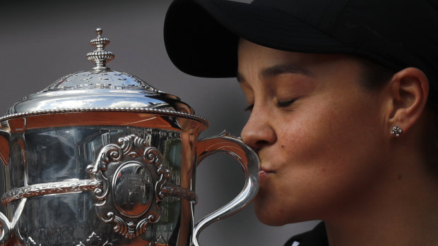 Australia's Ashleigh Barty kisses the trophy as she celebrates winning her women's final match of the French Open