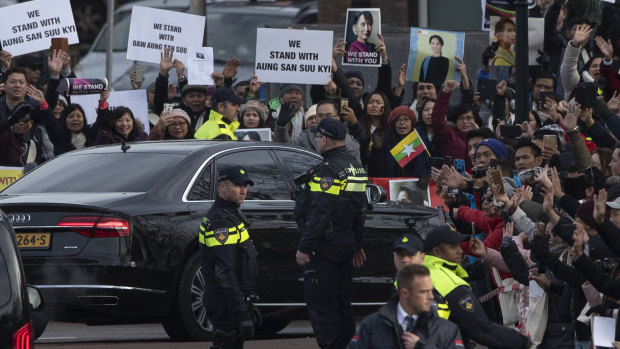 Supporters greet Myanmar's leader Aung San Suu Kyi as she leaves the International Court of Justice in The Hague, Netherlands.