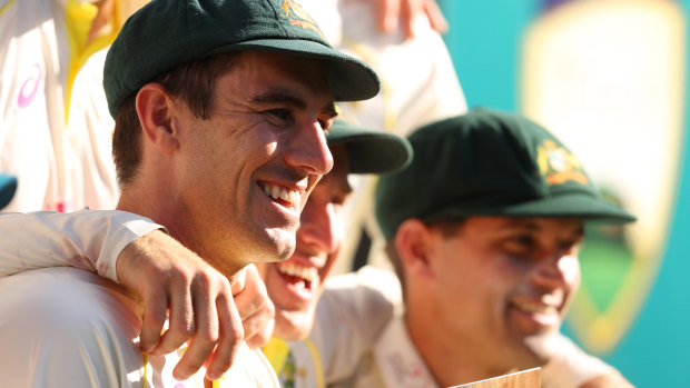 Cummins celebrates with his Test teammates after their series win over South Africa.