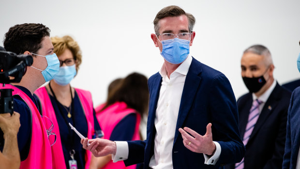 Booster push: NSW Premier Dominic Perrottet at the new Granville Centre vaccination clinic on Monday. 