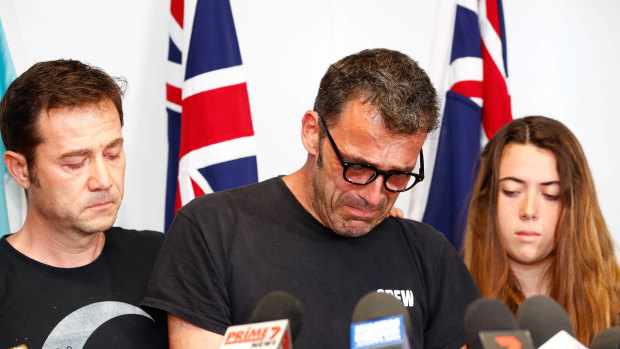 Theo Hayez's father, Laurent, with Theo's godfather Jean-Philippe Pector and cousin Lisa Hayez during the emotional press conference in Byron Bay.