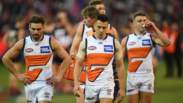The Giants trudge off after their heavy pre-finals defeat by Melbourne.