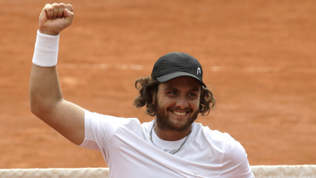 Argentina's Marco Trungelliti raises his fist in victory after defeating Australia's Bernard Tomic.