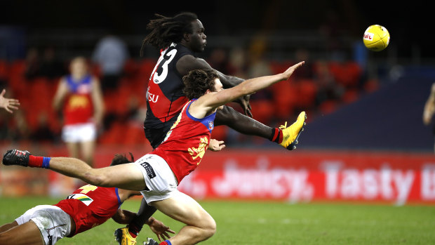 Tip top: Essendon's Anthony McDonald-Tipungwuti evades a smother to get a shot on goal.