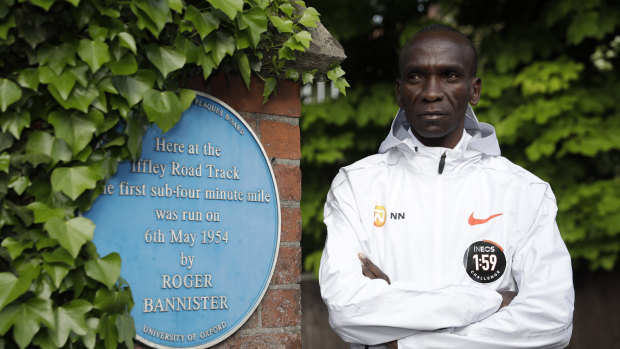 No limits: Eliud Kipchoge poses alongside a plaque commemorating Roger Bannister's four-minute mile.