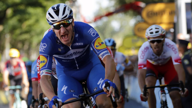 Italy's Elia Viviani celebrates winning the fourth stage of the Tour de France.
