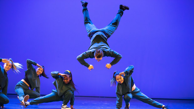 Thomas Adams-Walker mid-air in Canberra College's dance piece.