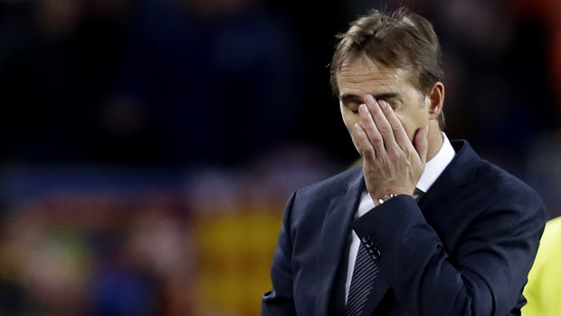 Pressure intensified: Lopetegui walks from the pitch after the heavy defeat.
