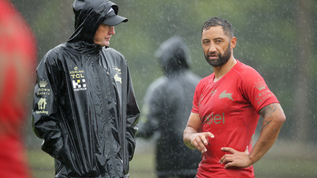 Benji Marshall and Wayne Bennett stop for one of their many chats at a soggy Redfrern this week.