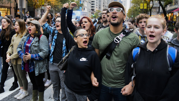 'Black Lives Matter' marchers  close down Chicago's Michigan Avenue as they  celebrate the verdict. 