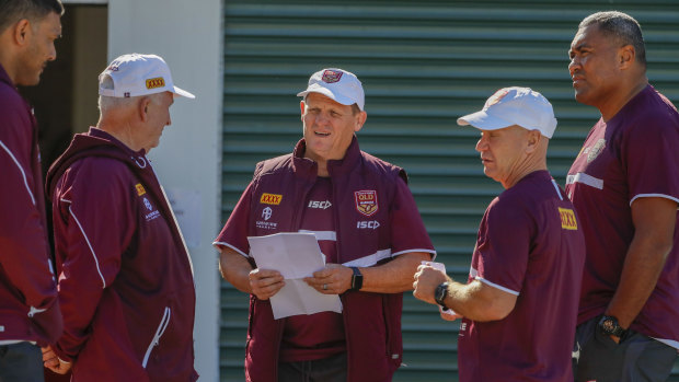Brains trust: Maroons coach Kevin Walters and his coaching staff hatch a plan at training on Thursday.