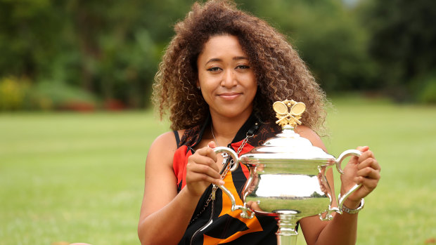 Naomi Osaka poses with the Daphne Akhurst Memorial Trophy after winning the 2021 Australian Open.