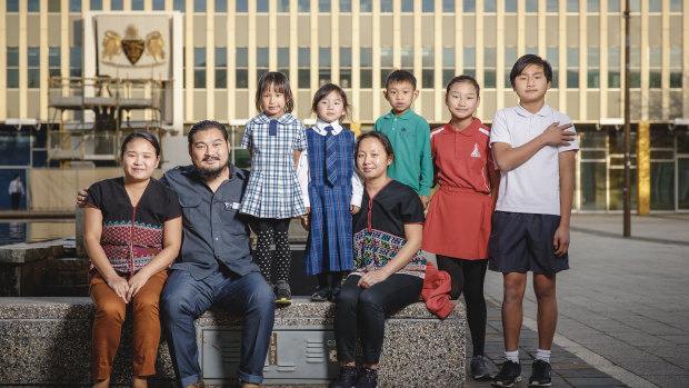 The family, some of them Canberra-born, are thriving in the capital. (From left) Lah Gray Paw, Moo K'Lue Di Gay, Olivia A Sein, Emiliana Di Gay, Rebecca Di Gay, Antonious A Sein, Eh Tha Yu Htoo Di Gay, and Kyaw Kyaw Poe Di Gay. 