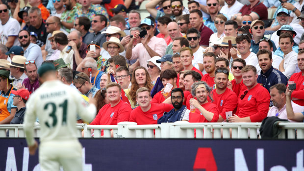 An English offers David Warner tea and biscuits.
