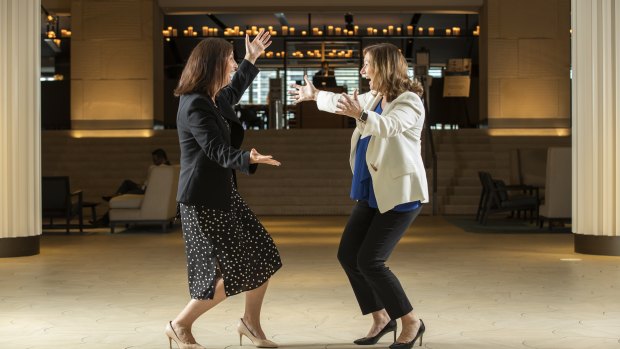 Hyatt Regency general manager Jane Lyons and Business Events Sydney chief executive Lyn Lewis-Smith demonstrate how COVID-19 has affected personal greetings in the workplace. 