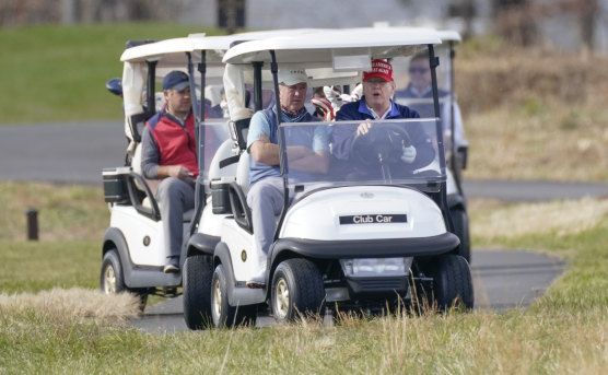 Donald Trump plays golf last month.
