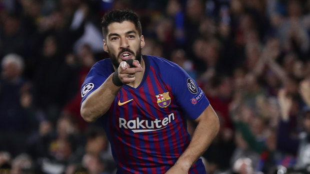 Luis Suarez celebrated after opening the scoring against his old side.