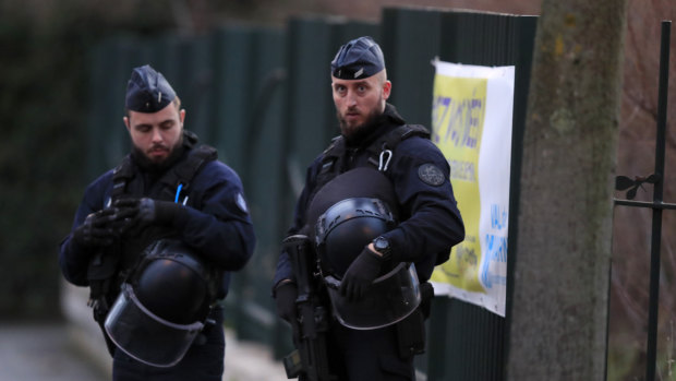 Riot police officers look on after a man attacked passerby on Friday January 3, 2020 in Villejuif, south of Paris.