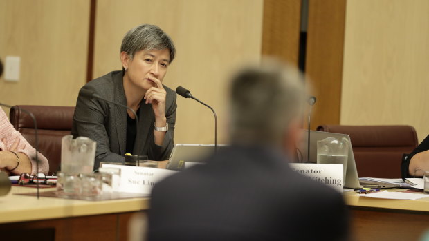Labor senator Penny Wong listens to Finance Minister Mathias Cormann in a committee hearing on Tuesday morning.