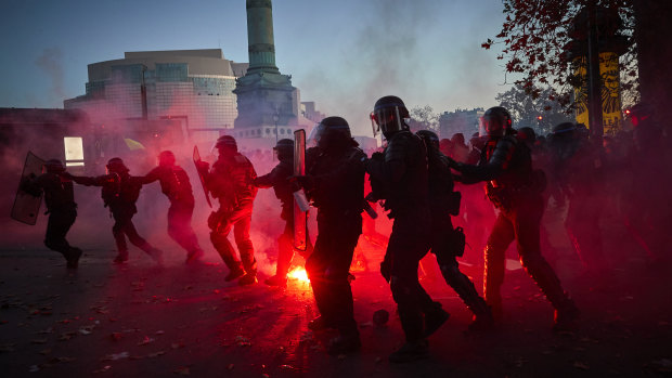 French Riot police clash with protestors as demonstrations against the French Government's Global Security Law turn violent near Place de la Bastille in Paris. 