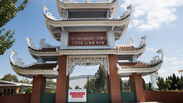 A sign on the front of the Linh Son Buddhist Temple indicating it was in mortgagee possession.