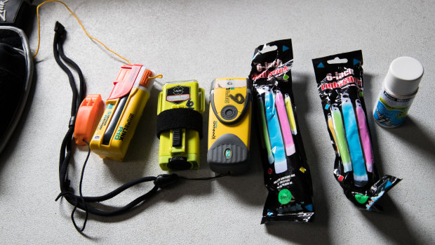Lifesaving essentials: (From left) a whistle, an AIS beacon, a strobe light, a personal locator beacon, glow sticks and sea dye.