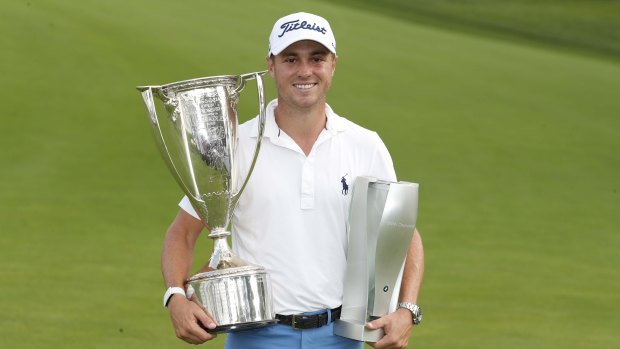 Justin Thomas with the spoils of victory from the BMW Championship.