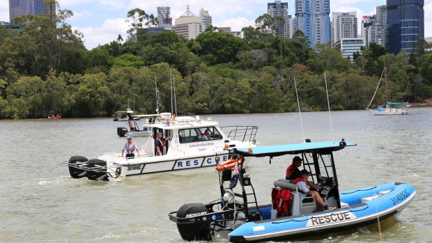 Volunteer Marine Rescue Brisbane search for a man who was reported missing after falling into the Brisbane River near the Kangaroo Point cliffs.