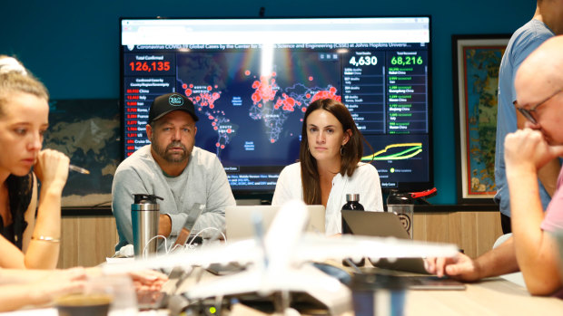 TripADeal chief executive Norm Black  and marketing manager Lucy Walgers in the company's 'war room' in Byron Bay.