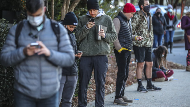 Voters wait on line to to cast their votes on Election Day in Atlanta.