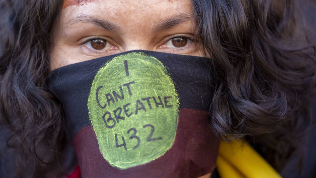 Protesters participate in a Black Lives Matter rally in Brisbane.