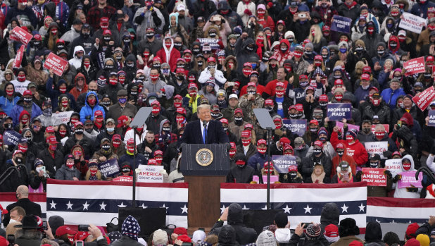 President Donald Trump speaks during a campaign rally in Lansing, Michigan. 