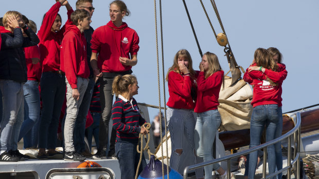 Teens wave, cry and hug as their schooner, carrying 25 Dutch teens who sailed home from the Caribbean across the Atlantic when coronavirus lockdowns prevented them flying, arrived at the port of Harlingen, Netherlands.