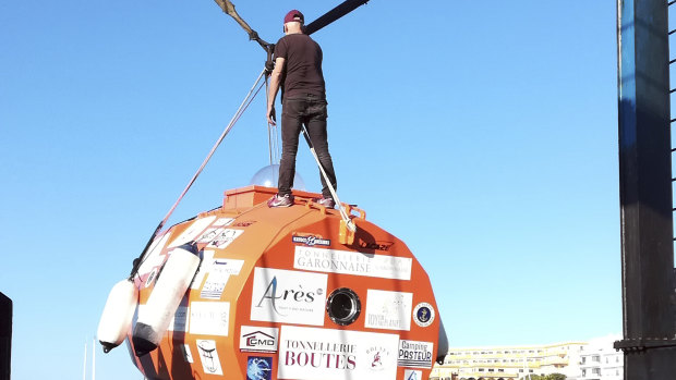 Jean-Jacques Savin, 71, stands on top of his ocean-going barrel.