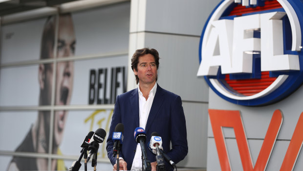 Gillon McLachlan outside AFL house where the men’s and women’s league logos are situated.