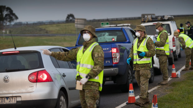Soldiers assist police at a checkpoint near Geelong. 