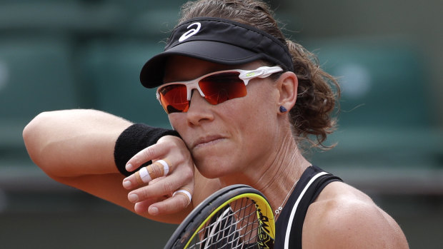The cheek of it: Samantha Stosur was bailed out of the French Open by 2016 champion Garbine Muguruza.